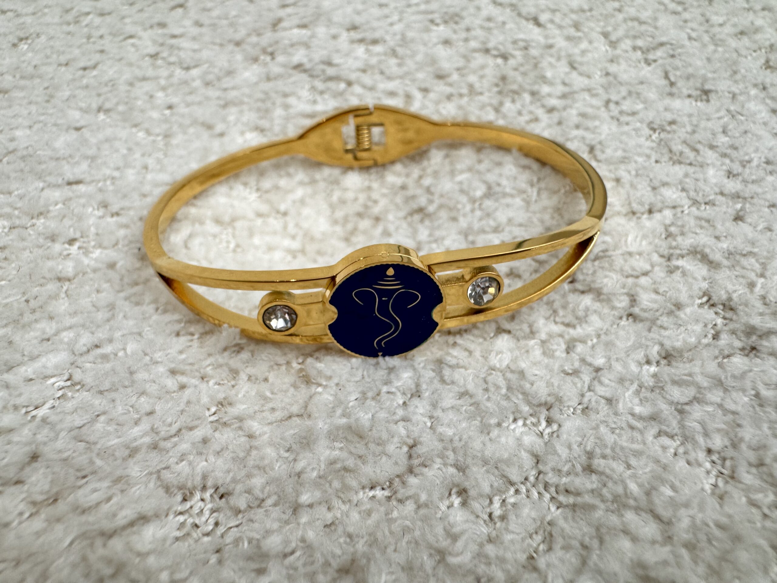 Ganpati inspired bluestone gold plated bracelet